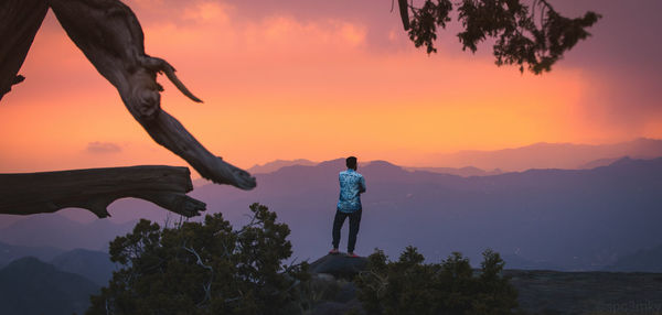 Man staring at the sunset in abha, saudi arabia 