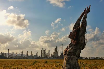 Panoramic view of statues on field against sky