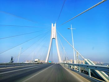 View of bridge against blue sky