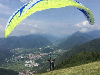 Rear view of man standing on mountain