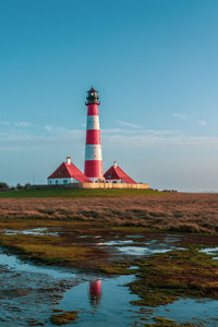 Westerheversand lighthouse on the north sea a landmark of the eiderstedt peninsula in germany.