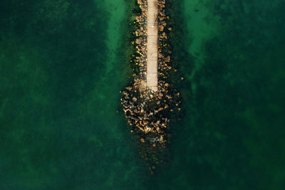 Aerial view of pier by sea