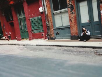 Man standing in front of building