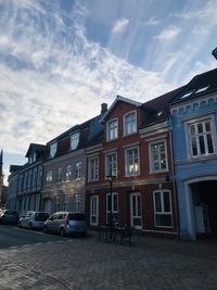 Building by street against sky