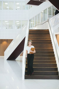 Portrait of young professional in building office hall