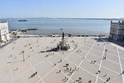 High angle view of crowd by sea against sky