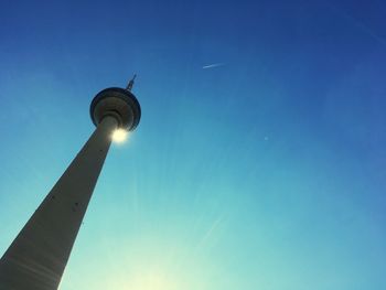 Low angle view of tv tower  against blue sky