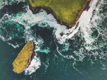 High angle view of water flowing through rocks