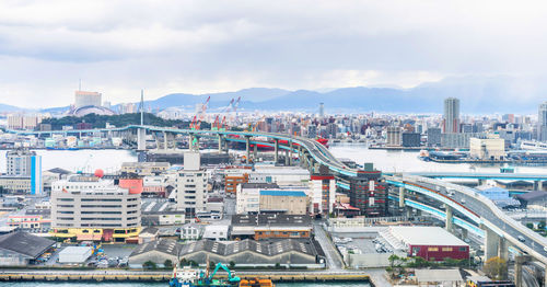 High angle view of buildings against sky in city