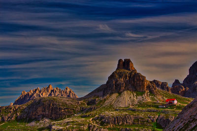 Scenic view of mountain against cloudy sky