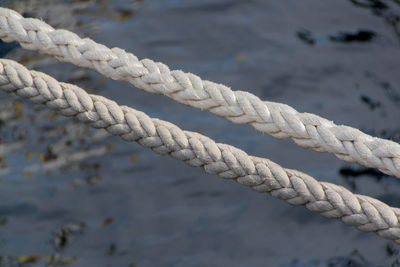 Close-up of rope tied to bollard