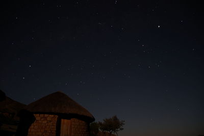 Low angle view of building against sky at night