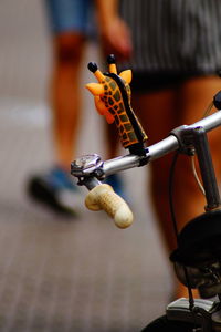 Close-up of toy on bicycle handle