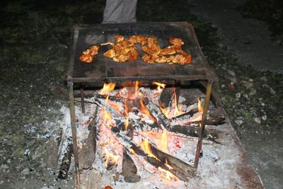 High angle view of meat on barbecue grill