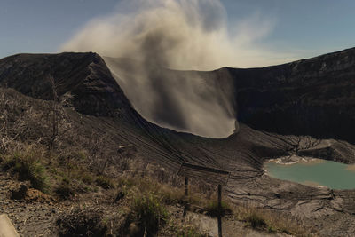 Scenic view of volcanic mountain against sky