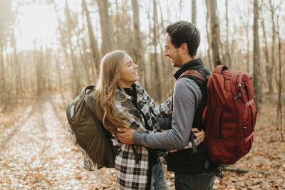 Young couple standing in forest