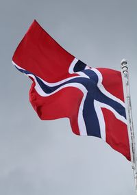 Low angle view of flag against sky