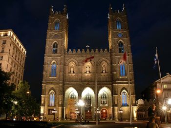 Illuminated cathedral against sky at night