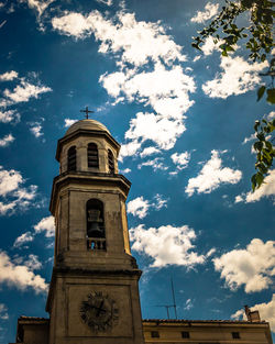 Low angle view of bell tower against sky