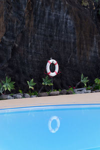 Swimming pool against rock formation