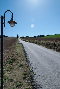 Road amidst landscape against clear sky