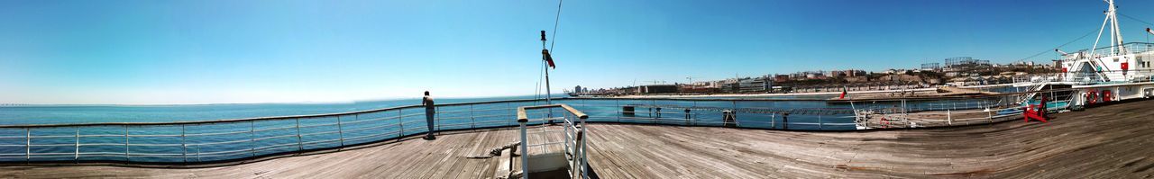 Panoramic view of sea against clear sky