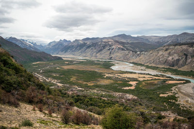 Scenic view of valley mountains against sky in autumn