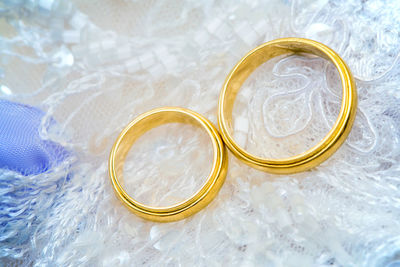 Close-up of wedding rings on table