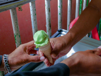 Midsection of man working with ice cream