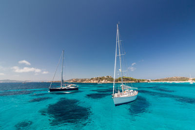 Boats on anchor in the crystal clear waters of sardinia