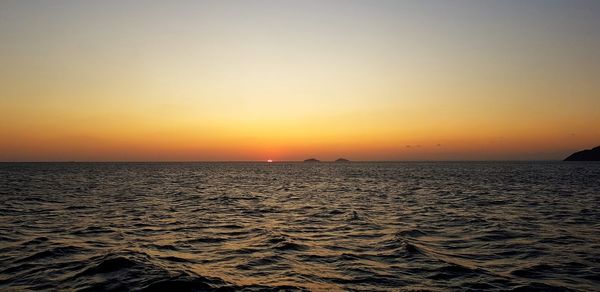 Scenic view of sea against sky during sunset