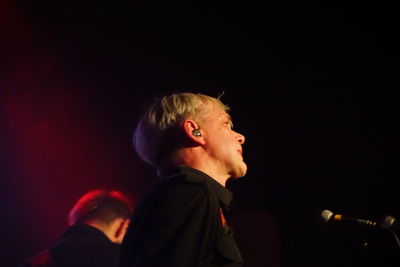 Portrait of man and woman at music concert