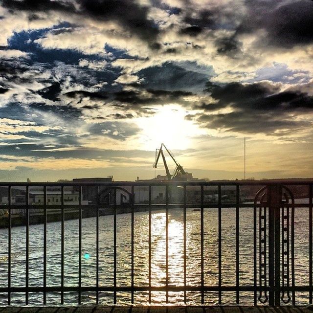 sky, cloud - sky, sunset, railing, cloudy, built structure, sea, cloud, water, architecture, bridge - man made structure, silhouette, connection, nature, scenics, horizon over water, beauty in nature, sun, tranquility, pier