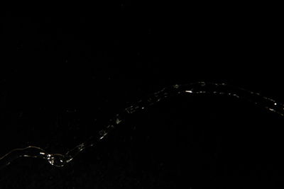 View of illuminated ferris wheel at night