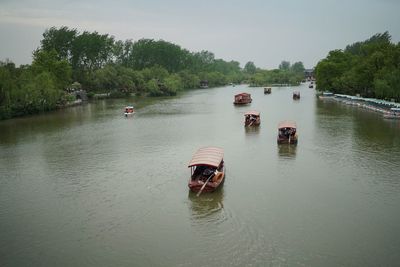 High angle view of people on boat sailing in river