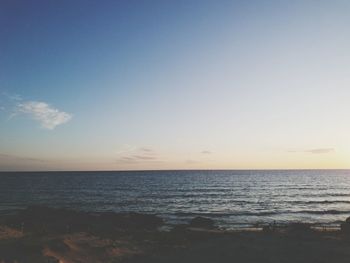 Scenic view of sea against sky at sunset