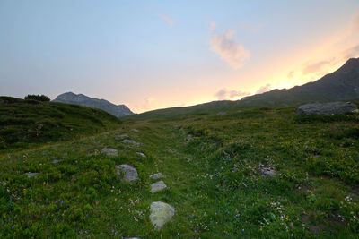 Scenic view of landscape against sky during sunset