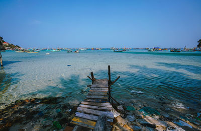 Scenic view of sea against clear blue sky