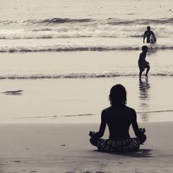 Rear view of women on beach