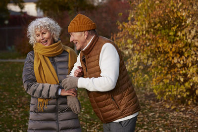 Senior couple in autumn scenery