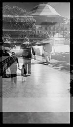 Woman standing by railing