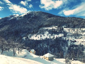 Scenic view of snowcapped mountains against sky