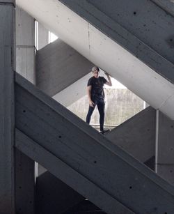 Full length of man standing on staircase