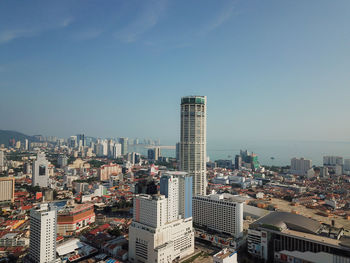 High angle view of modern buildings in city against sky