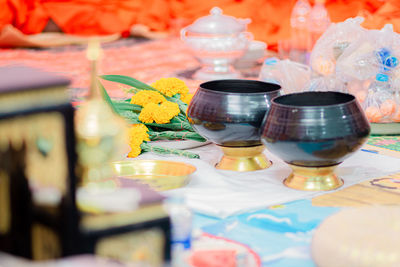 Close-up of multi colored religious offering on table