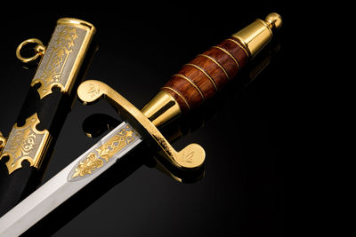 Low angle view of key against black background