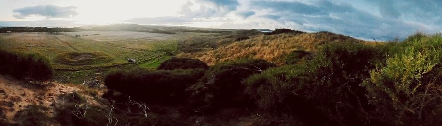 Scenic view of land against sky