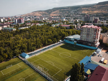 Makhachkala, football field and mountains