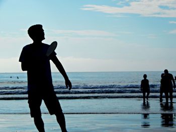 People standing on beach