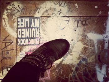 Close up of person standing on tiled floor